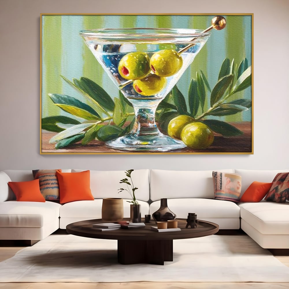 Tablou canvas cu pictura cu pahar martini si masline, in rama de aluminiu auriu, pe perete intr-un living